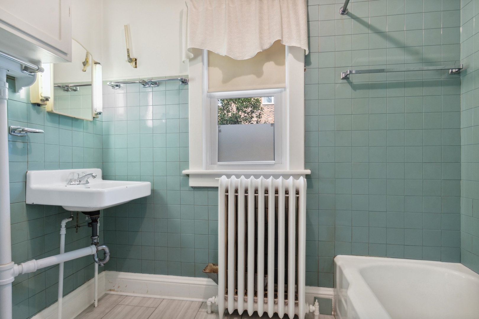 320 Prairie Avenue Highwood, IL 60040 - Photo 9 of 14 a bathroom with a sink a toilet and shower