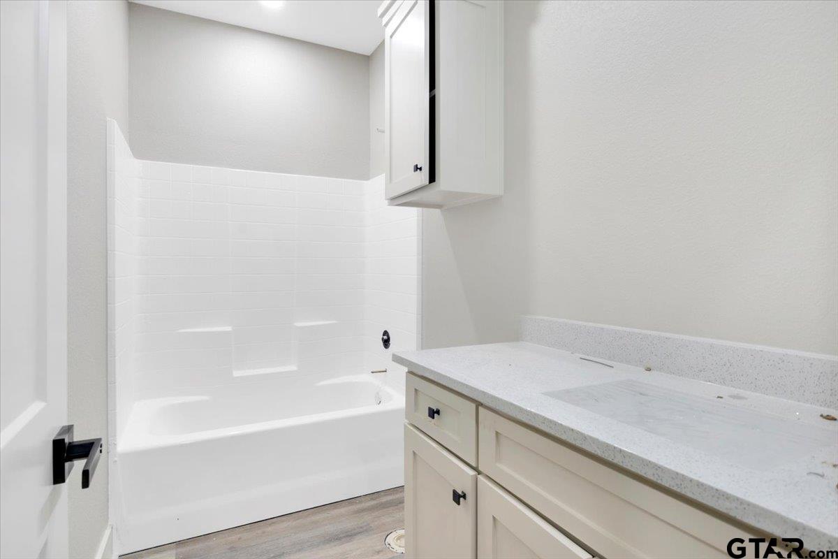 147 Arvel Street Bullard, TX 75757 - Photo 16 of 23 a bathroom with a bathtub and a sink