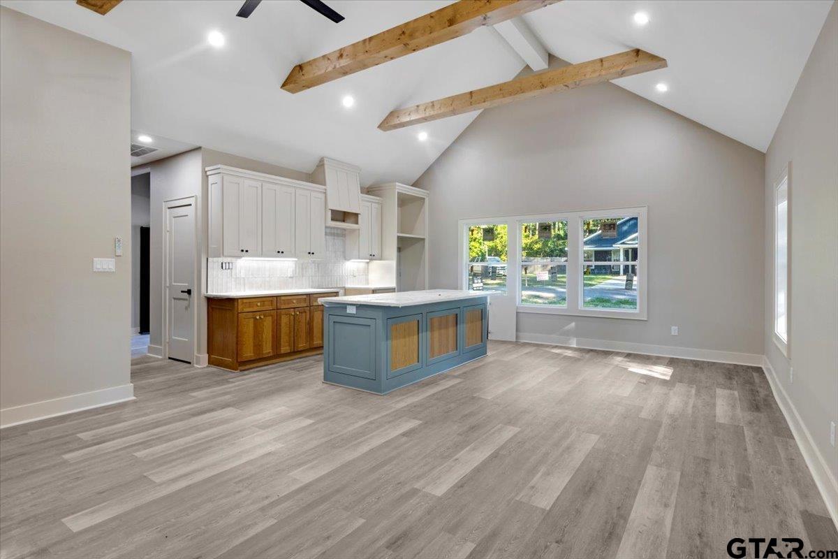 147 Arvel Street Bullard, TX 75757 - Photo 5 of 23 a large kitchen with stainless steel appliances a large counter top and a wooden floors