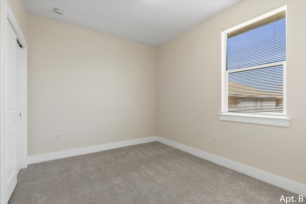 2225 Katy Lane, Unit B Georgetown, TX 78626 - Photo 17 of 22 Unfurnished bedroom featuring a closet and carpet