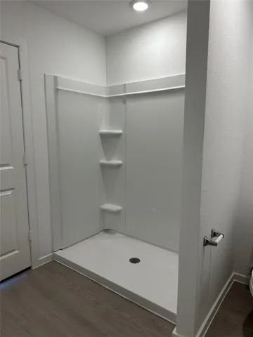 a view of an empty room with windows