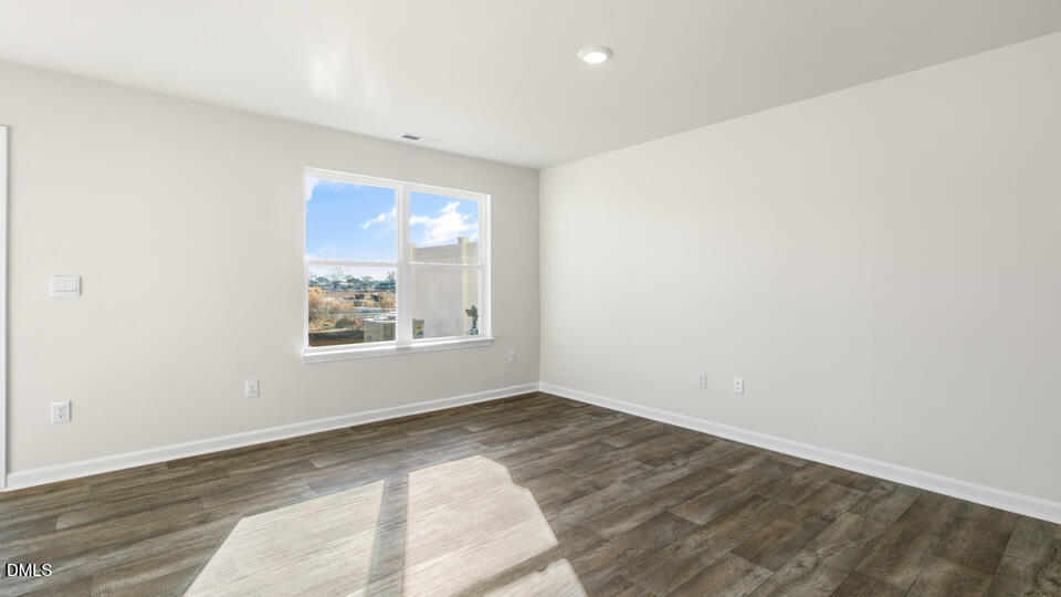 21 Bee Garden Angier, NC 27501 - Photo 13 of 33 an empty room with wooden floor and windows