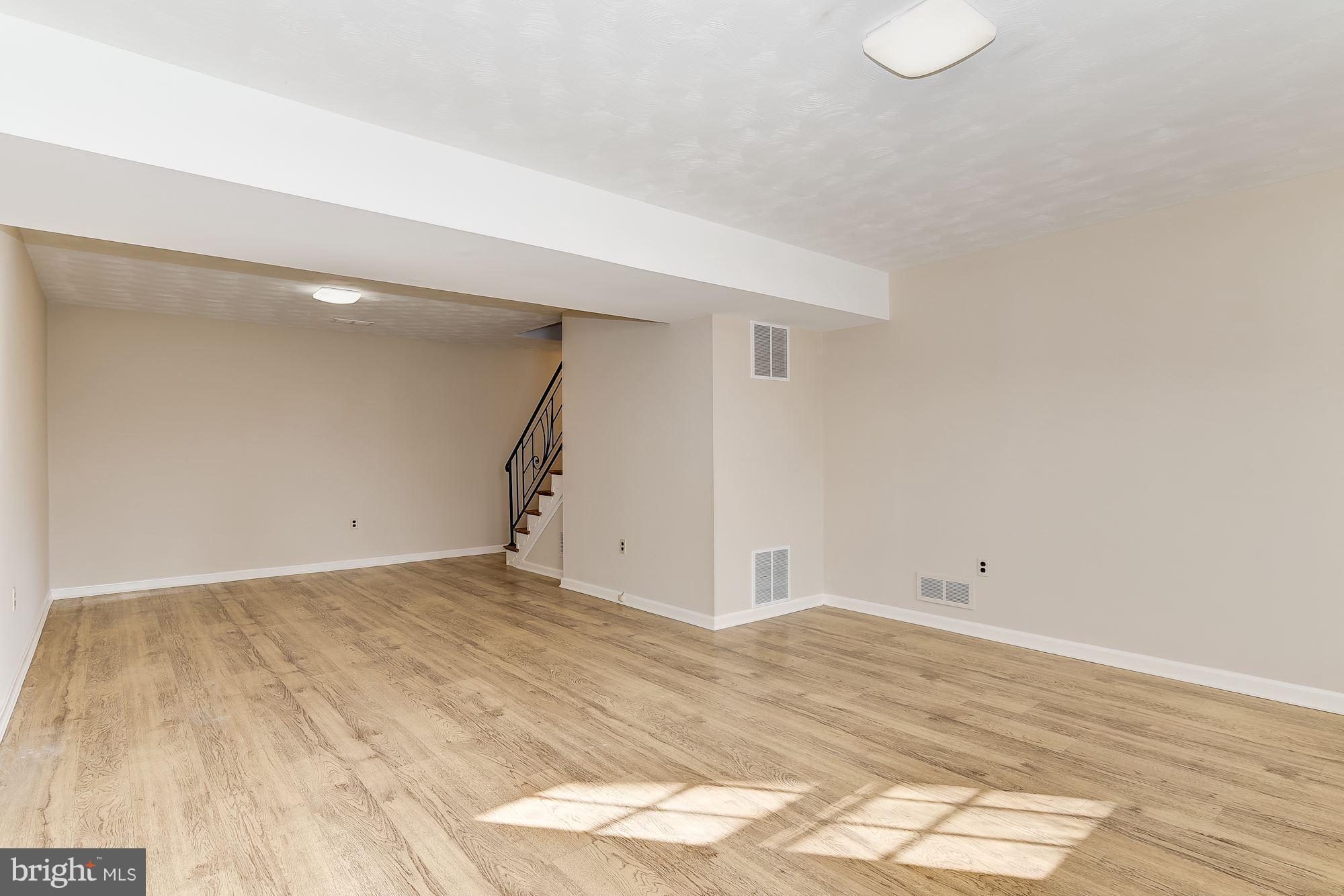 13449 Locksley Lane Silver Spring, MD 20904 - Photo 23 of 30 Inviting & Sun-Filled Lower Level Family Room
