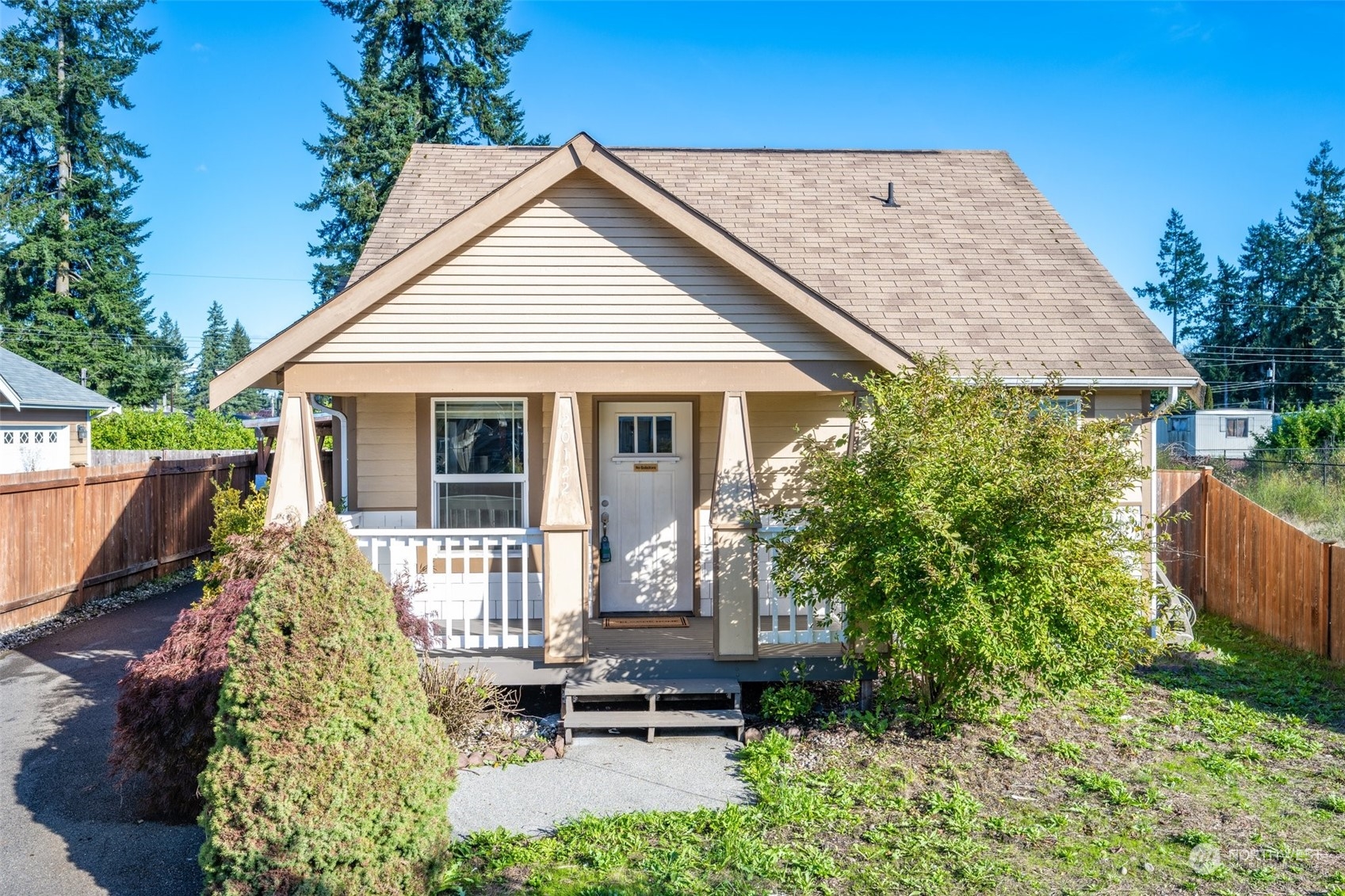 front view of a house with a yard