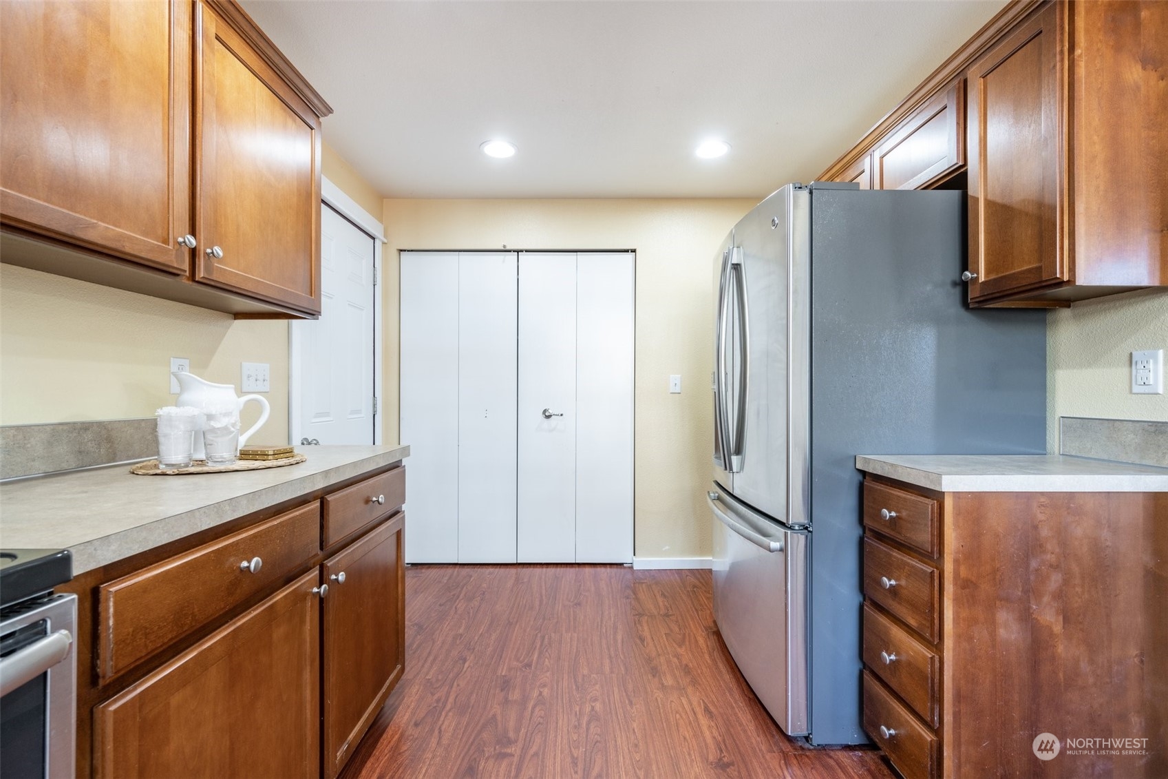 20122 Shamon Court Southwest Centralia, WA 98531 - Photo 14 of 40 a kitchen with stainless steel appliances granite countertop a refrigerator a sink and wooden cabinets
