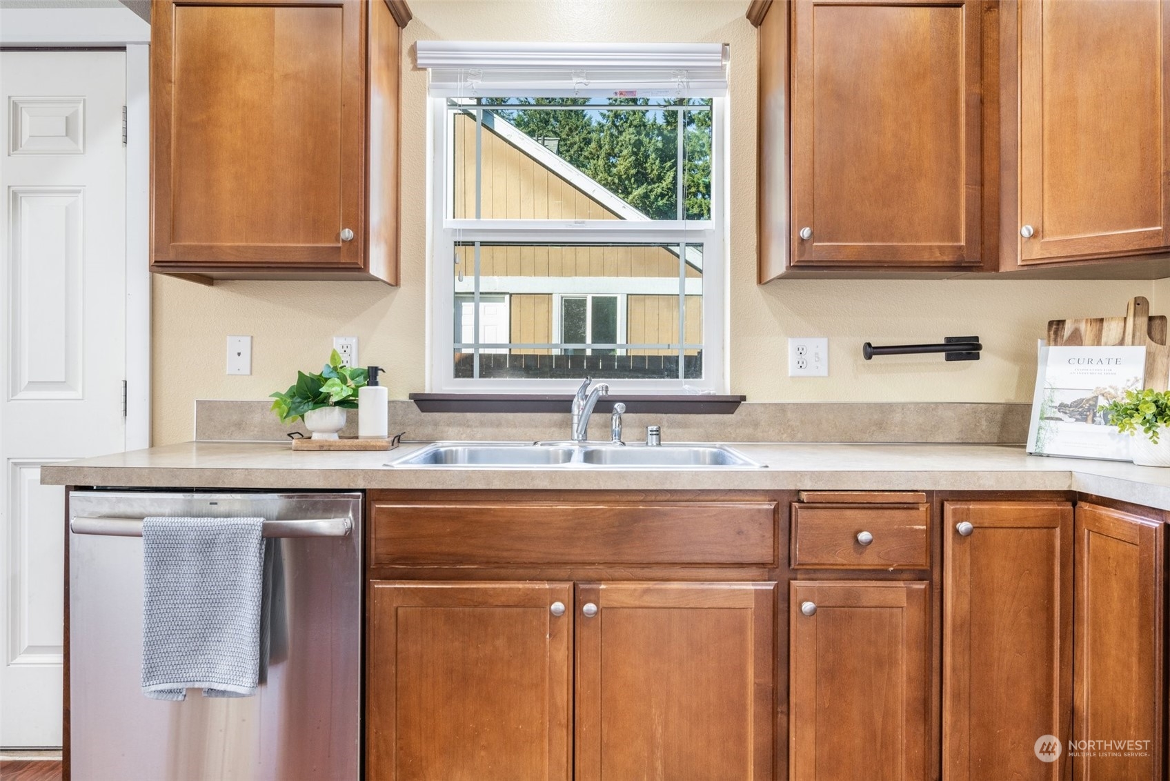 20122 Shamon Court Southwest Centralia, WA 98531 - Photo 16 of 40 a kitchen with stainless steel appliances granite countertop a sink a window and cabinets