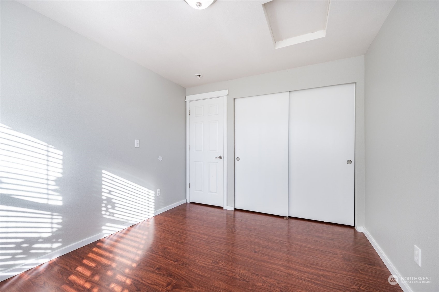 20122 Shamon Court Southwest Centralia, WA 98531 - Photo 27 of 40 a view of an empty room with wooden floor and a window