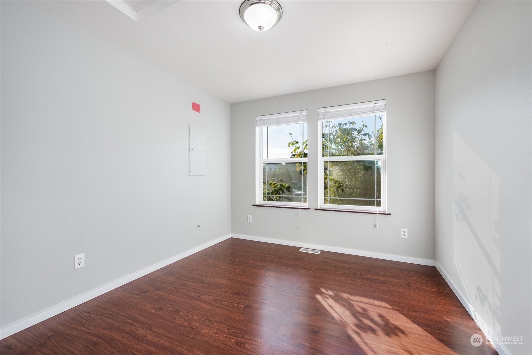 20122 Shamon Court Southwest Centralia, WA 98531 - Photo 28 of 40 a view of an empty room with wooden floor and a window