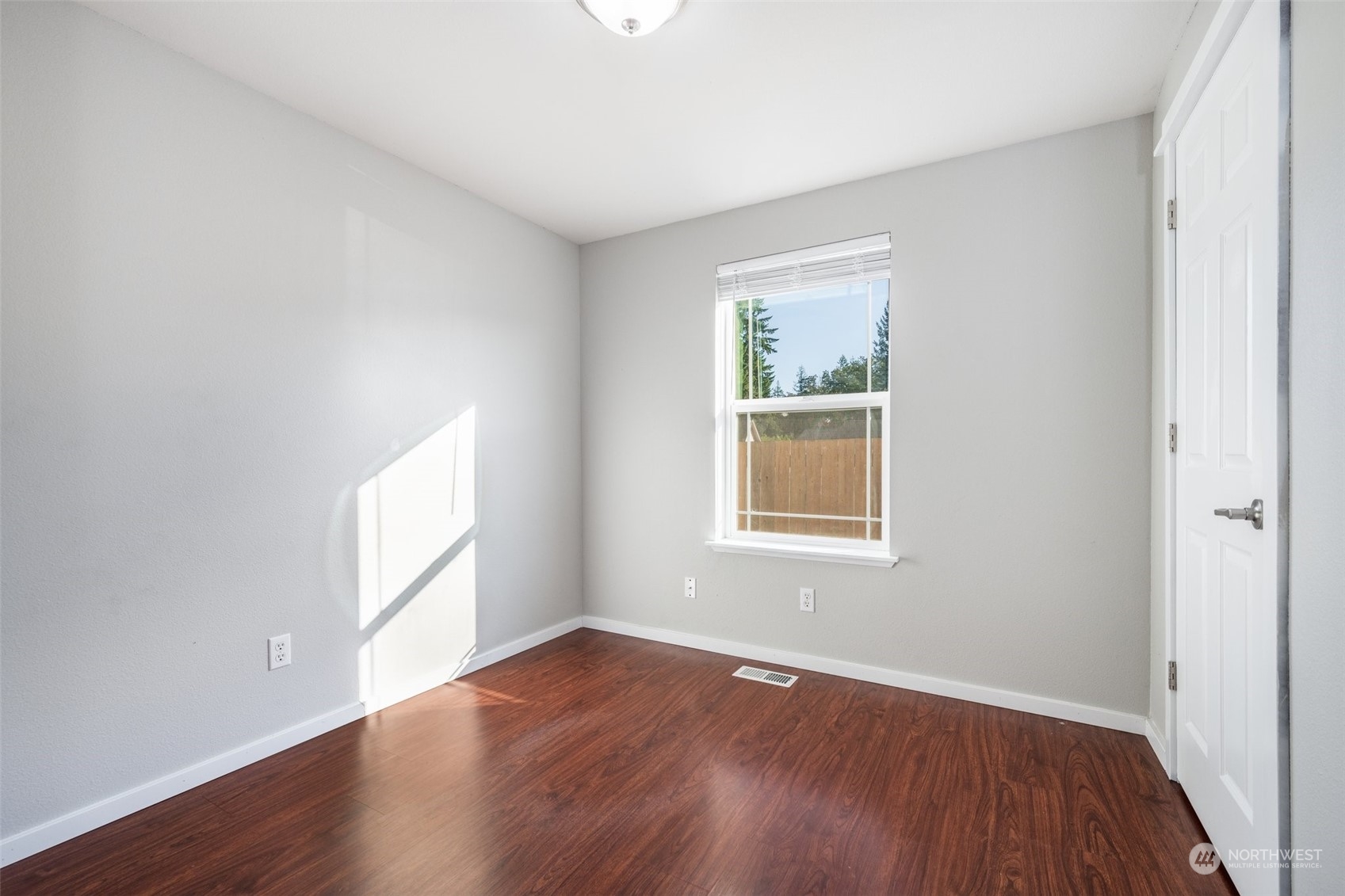 20122 Shamon Court Southwest Centralia, WA 98531 - Photo 29 of 40 an empty room with wooden floor and windows