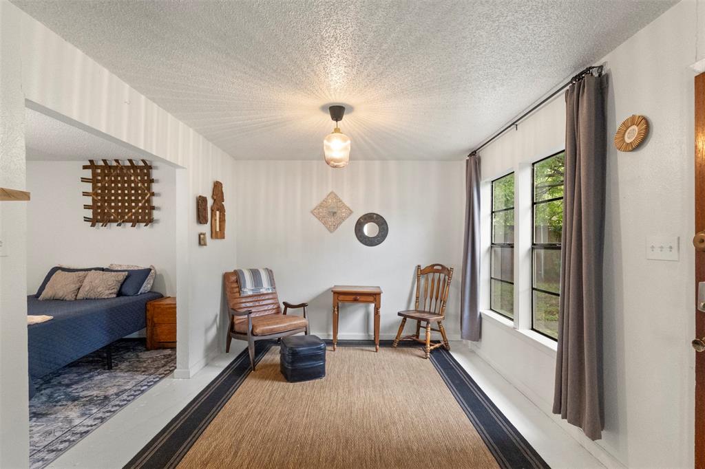 3304 Crest Ridge Drive Dallas, TX 75228 - Photo 13 of 16 a living room with furniture and a window