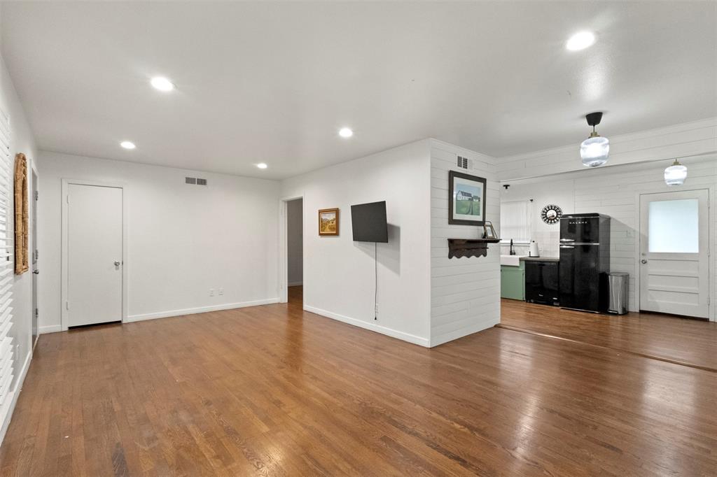 3304 Crest Ridge Drive Dallas, TX 75228 - Photo 4 of 16 a view of a kitchen with a sink and a refrigerator