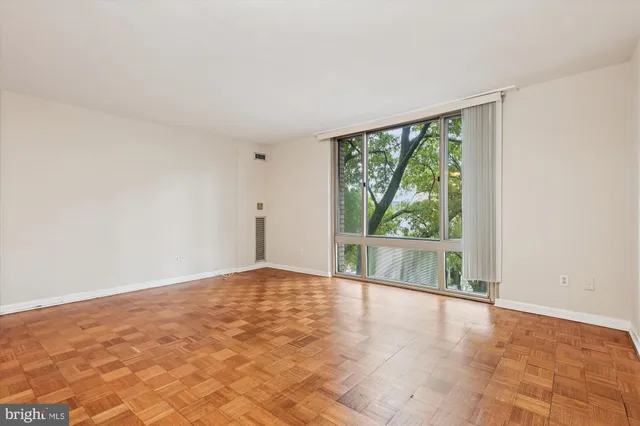a view of an empty room with a window