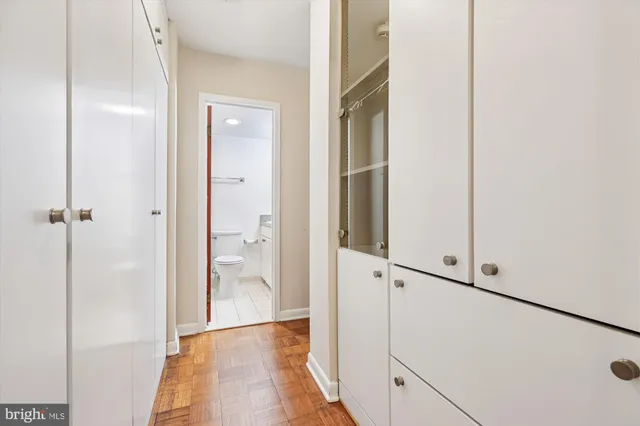 a view of a hallway with a glass door shower