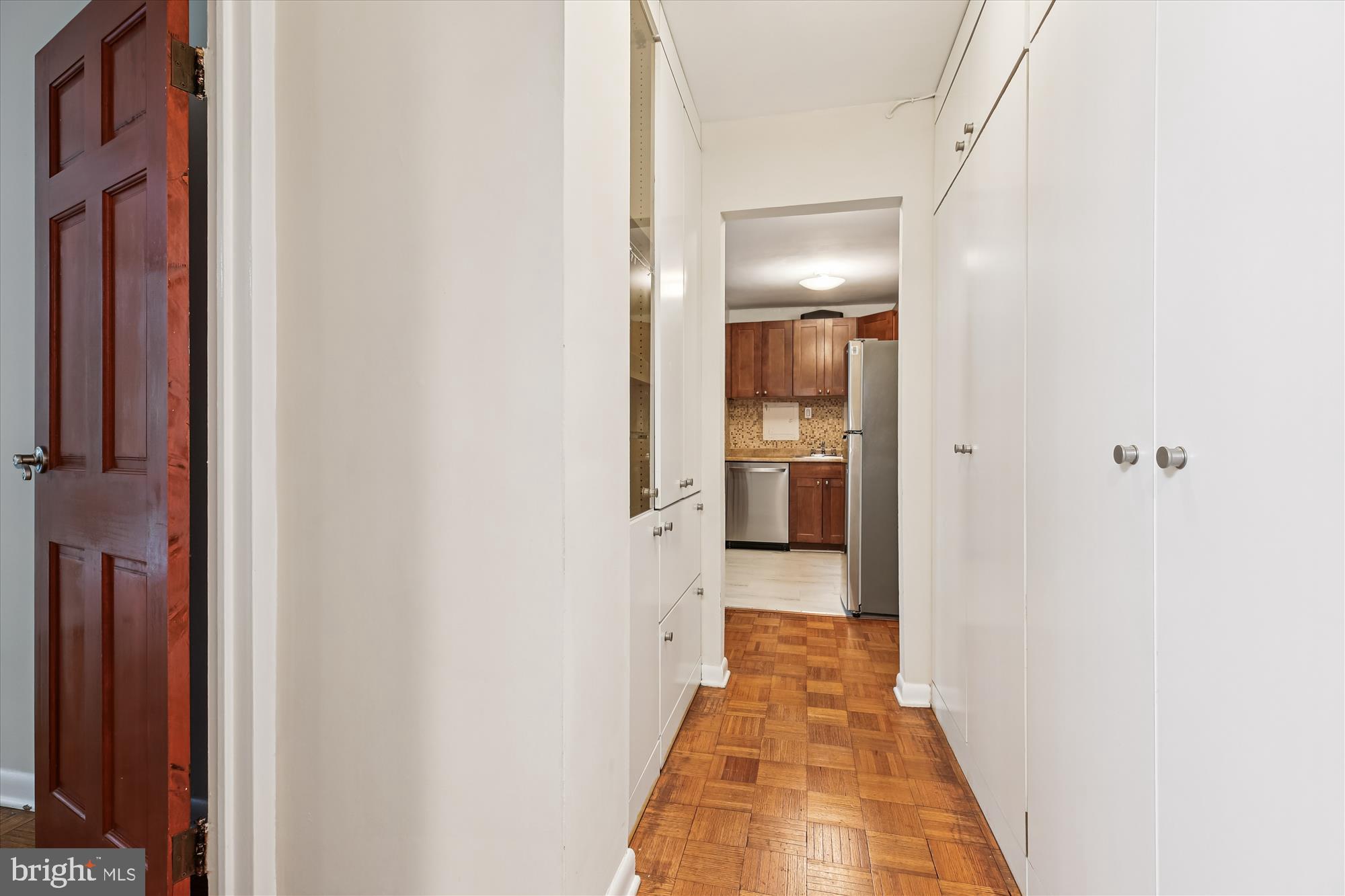 950 25th Street Northwest, Unit 709N Washington, DC 20037 - Photo 19 of 52 a view of a hallway with wooden floor