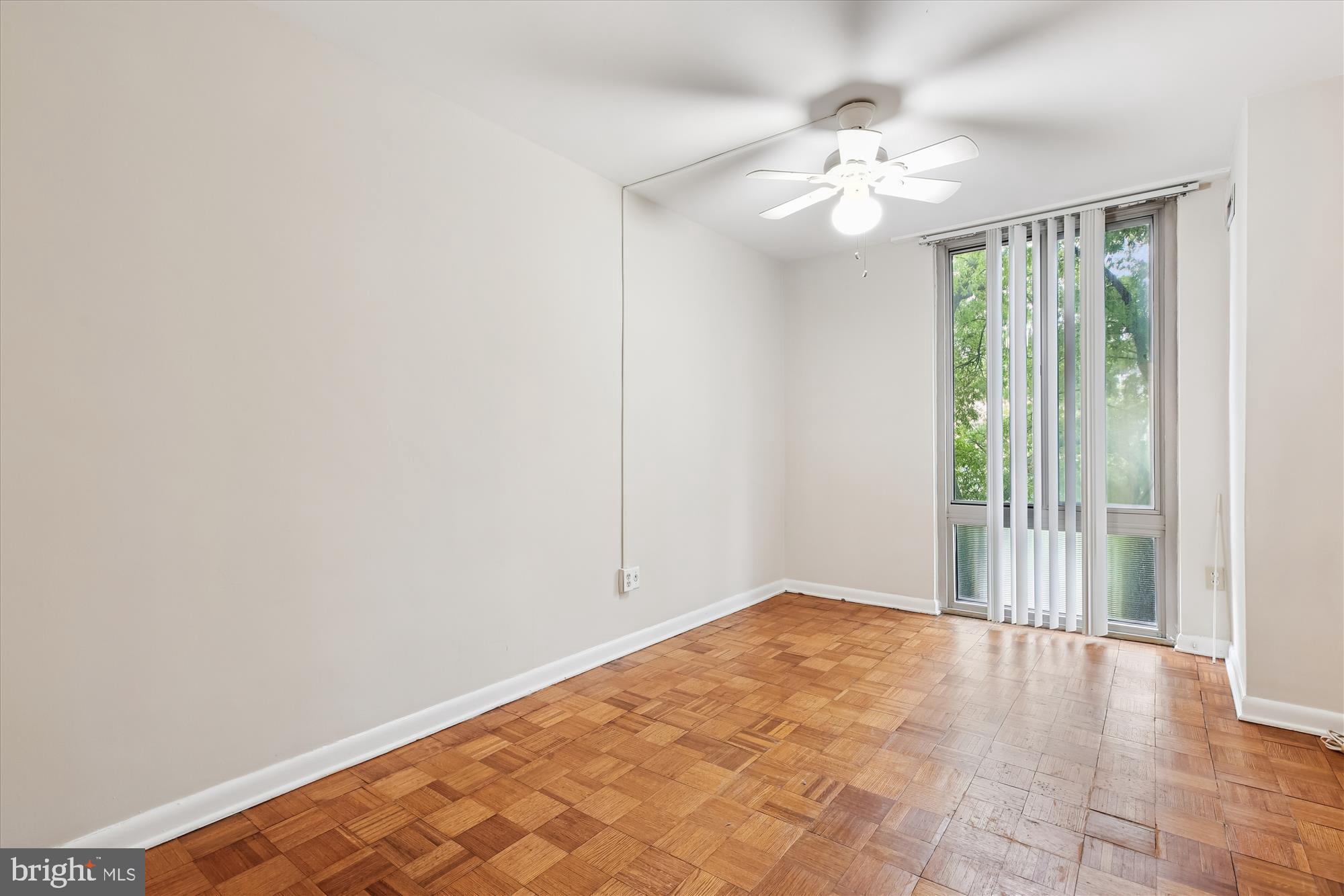950 25th Street Northwest, Unit 709N Washington, DC 20037 - Photo 22 of 52 wooden floor in an empty room with a window