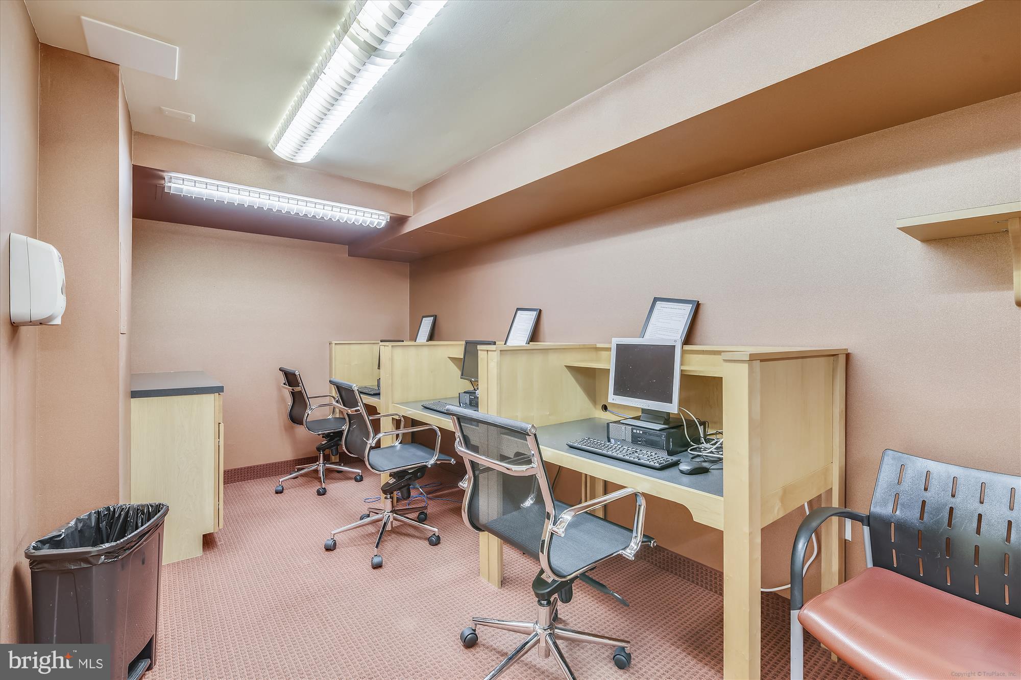 950 25th Street Northwest, Unit 709N Washington, DC 20037 - Photo 39 of 52 a workspace with furniture and a lamp