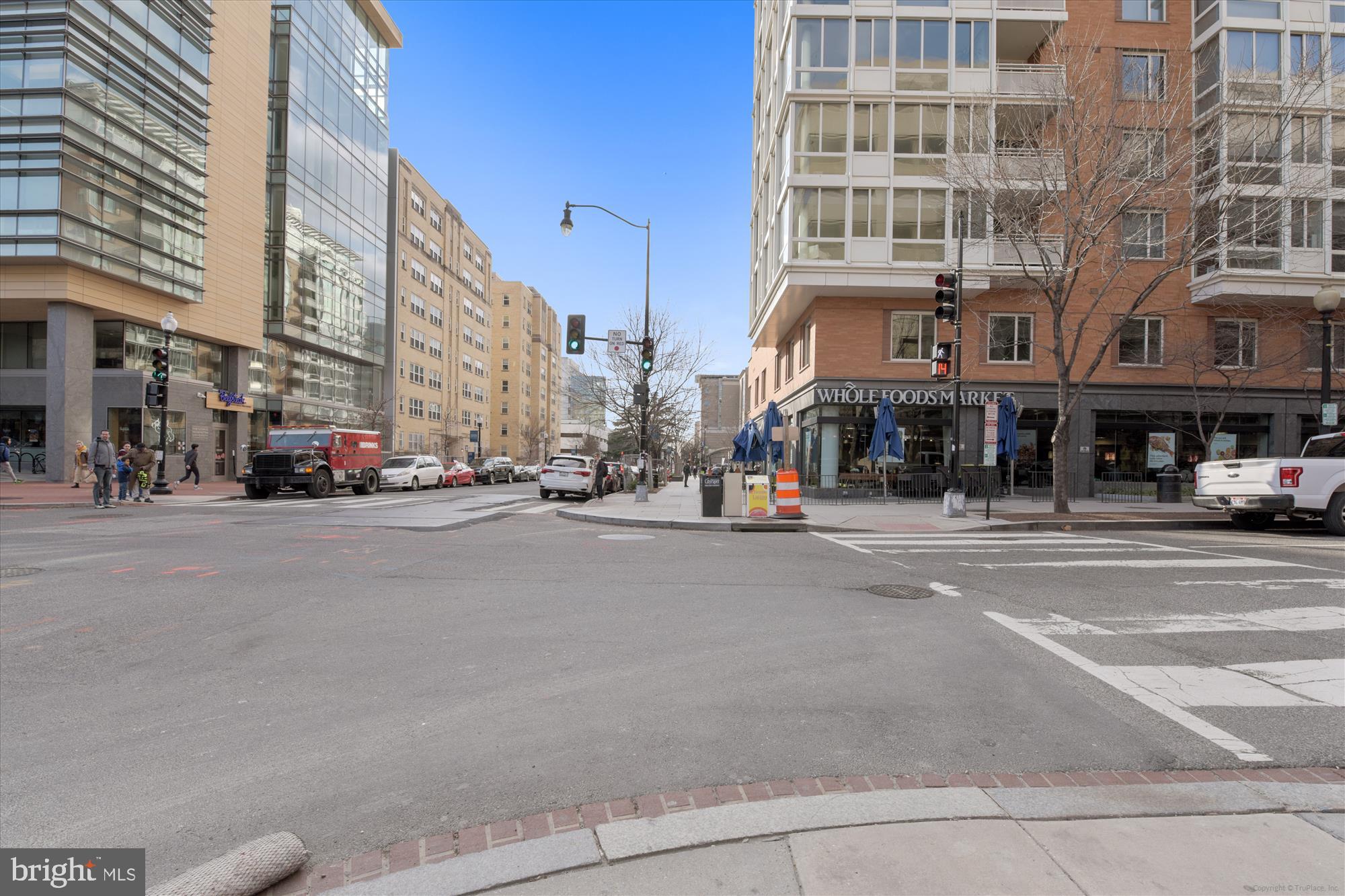 950 25th Street Northwest, Unit 709N Washington, DC 20037 - Photo 49 of 52 a city street with tall buildings