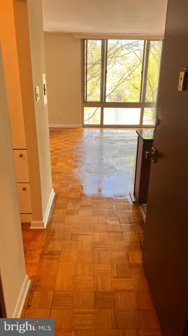 a view of an empty room with a window