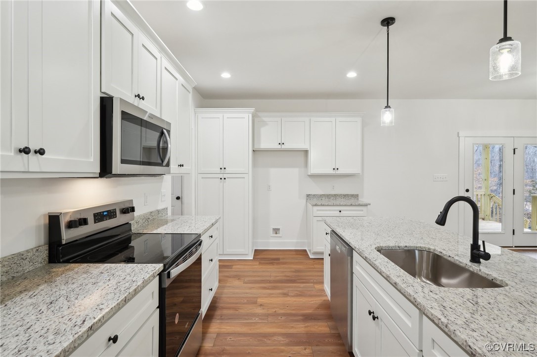 2359 Cedar Hill Road Mineral, VA 23117 - Photo 13 of 36 a kitchen with stainless steel appliances granite countertop a sink stove and refrigerator