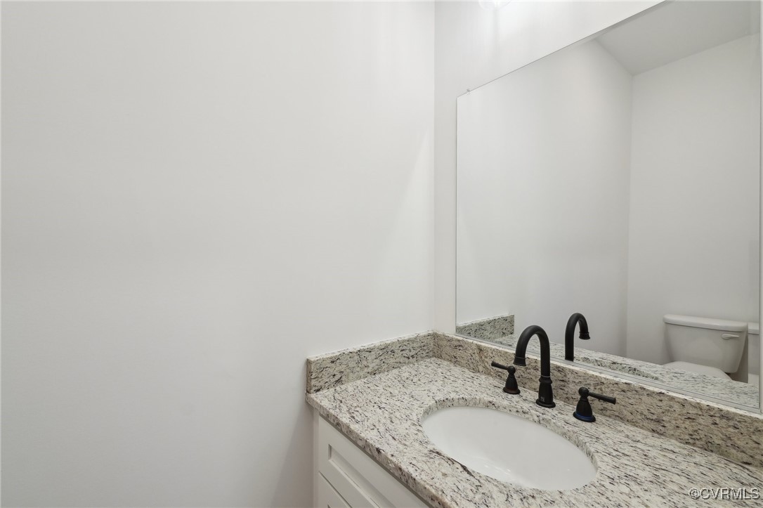 2359 Cedar Hill Road Mineral, VA 23117 - Photo 17 of 36 a bathroom with a granite countertop sink and a mirror