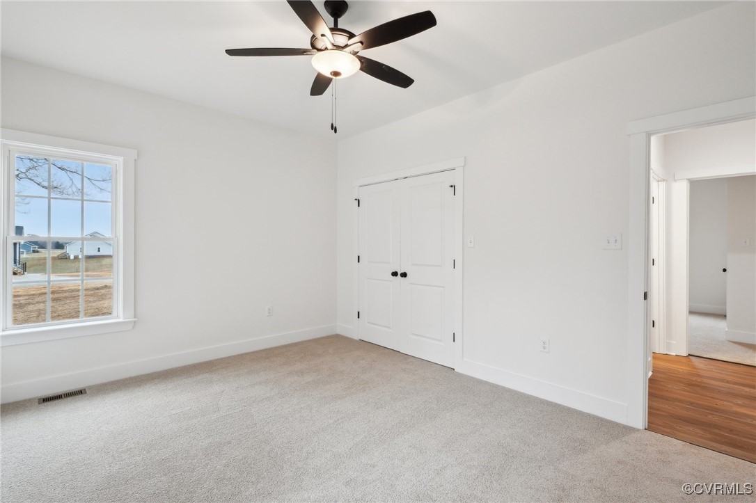 2359 Cedar Hill Road Mineral, VA 23117 - Photo 32 of 36 an empty room with a window and a fan