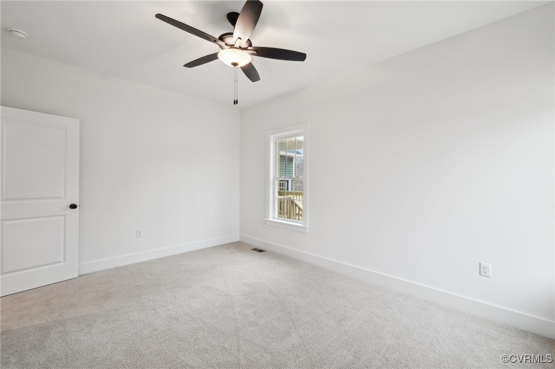 2359 Cedar Hill Road Mineral, VA 23117 - Photo 33 of 36 an empty room with a window and a fan