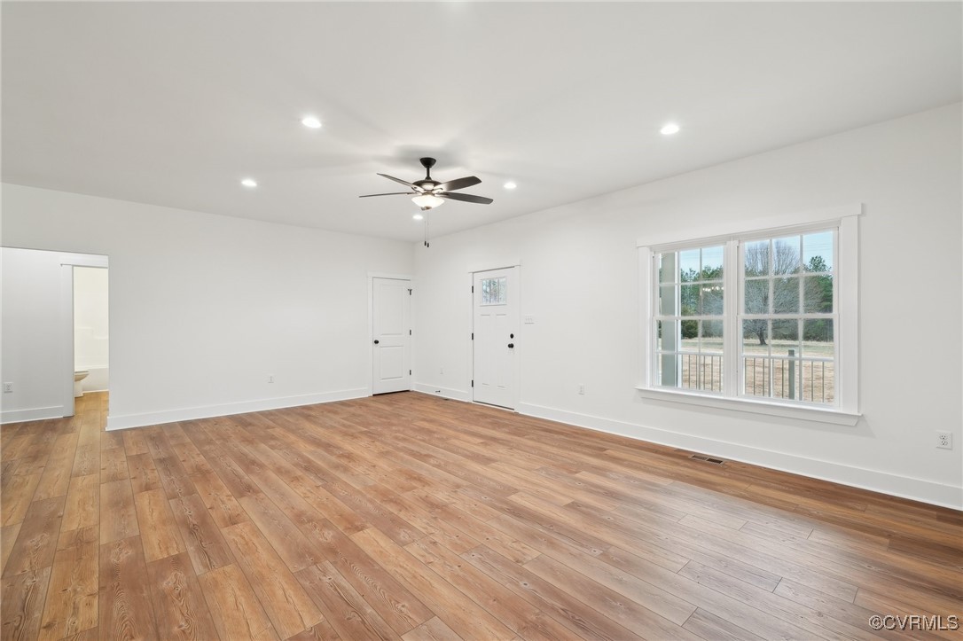 2359 Cedar Hill Road Mineral, VA 23117 - Photo 10 of 36 an empty room with wooden floor and windows