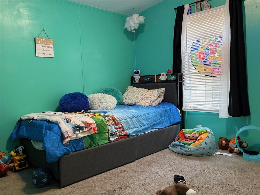 828 Harrison Road Carrollton, GA 30117 - Photo 12 of 20 a bedroom with bed and a window