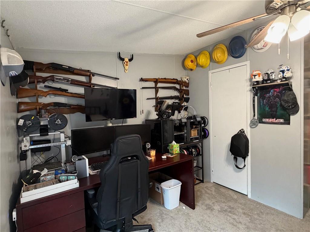 828 Harrison Road Carrollton, GA 30117 - Photo 14 of 20 a view of a workspace with furniture