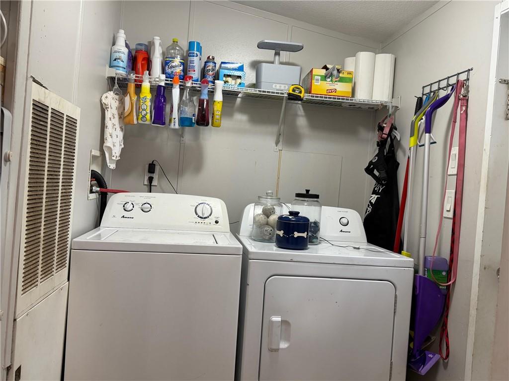 828 Harrison Road Carrollton, GA 30117 - Photo 16 of 20 a utility room with dryer and washer