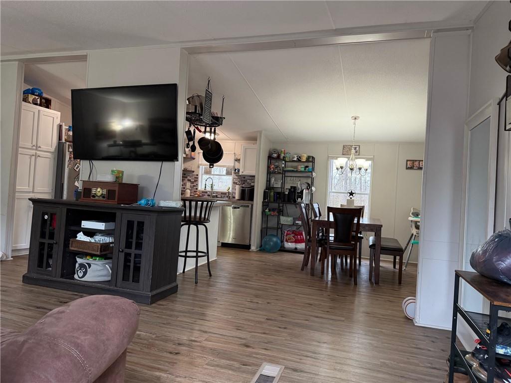 828 Harrison Road Carrollton, GA 30117 - Photo 2 of 20 a living room with furniture and a flat screen tv