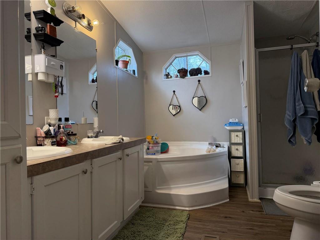 828 Harrison Road Carrollton, GA 30117 - Photo 9 of 20 a bathroom with a sink a toilet and shower