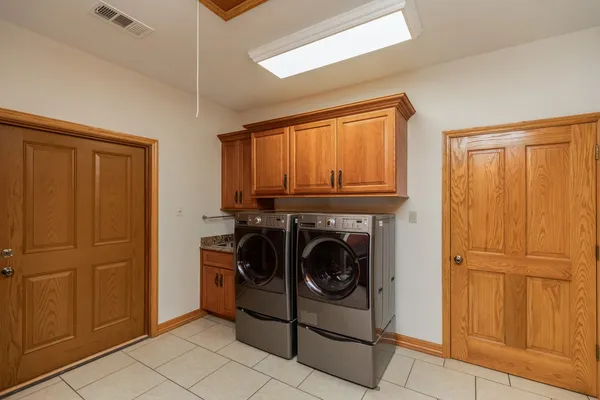 a utility room with dryer and washer