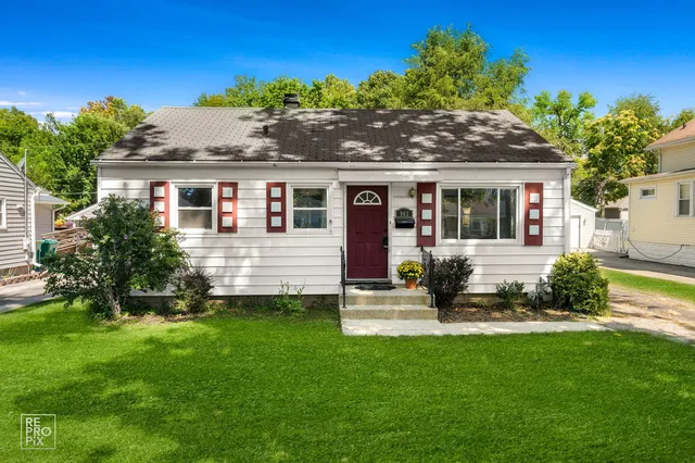a view of a house with a yard