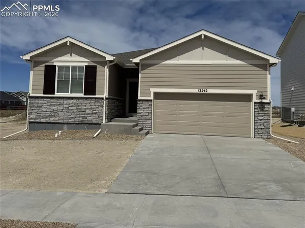 a front view of a house with a garage
