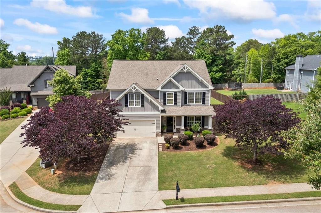 42 Pintail Lane Jefferson, GA 30549 - Photo 2 of 42 a view of a white house with a yard plants and large tree