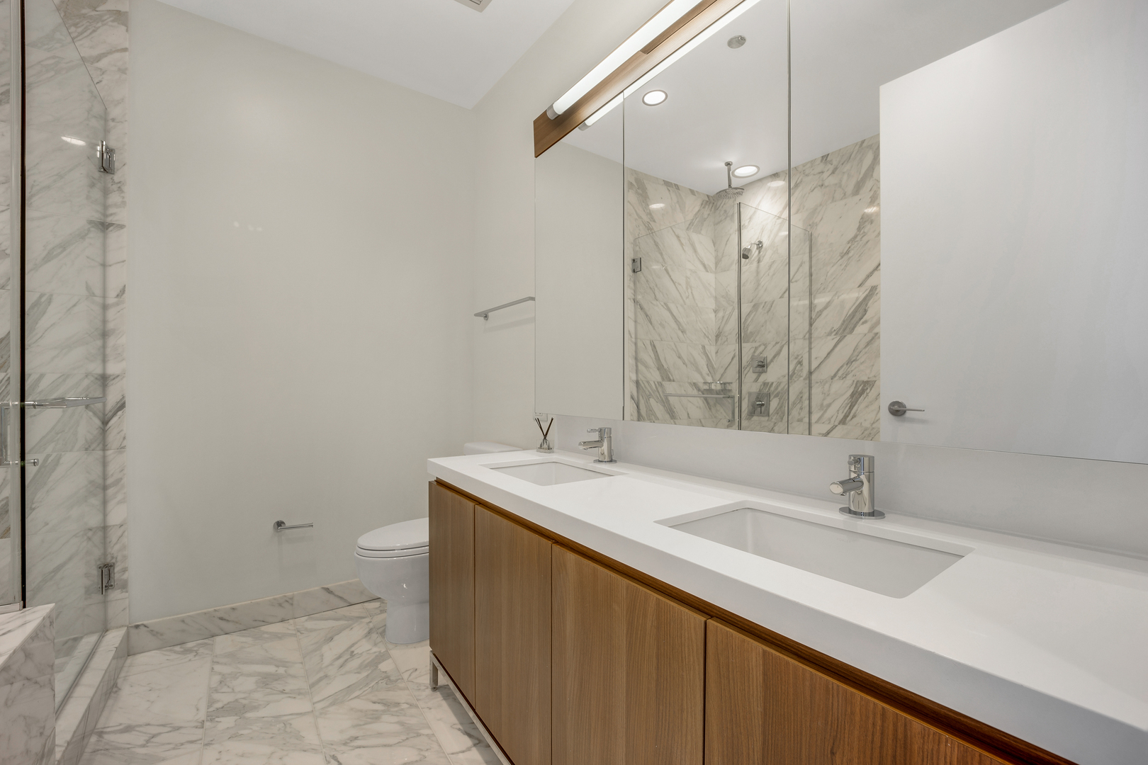 111 West Wacker Drive, Unit PH01 Chicago, IL 60601 - Photo 15 of 37 a bathroom with a sink and a mirror