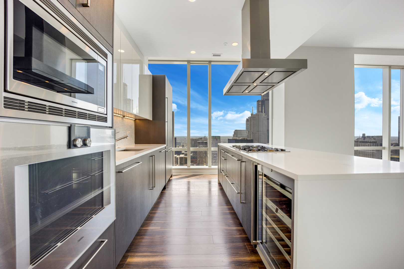111 West Wacker Drive, Unit PH01 Chicago, IL 60601 - Photo 3 of 37 a kitchen with stainless steel appliances granite countertop a stove and a sink