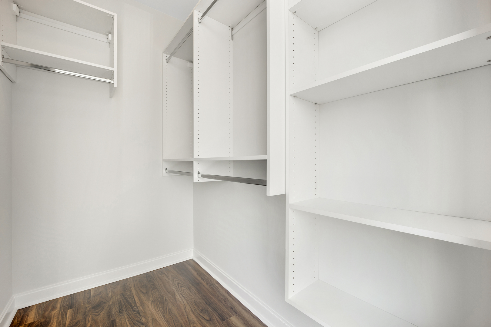 111 West Wacker Drive, Unit PH01 Chicago, IL 60601 - Photo 21 of 37 a view of walk in closet with empty racks