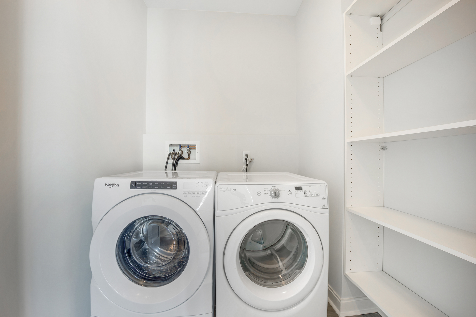 111 West Wacker Drive, Unit PH01 Chicago, IL 60601 - Photo 23 of 37 a utility room with dryer and washer
