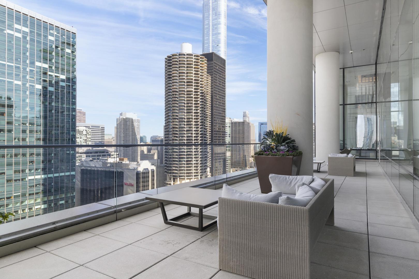 111 West Wacker Drive, Unit PH01 Chicago, IL 60601 - Photo 26 of 37 a living room with furniture