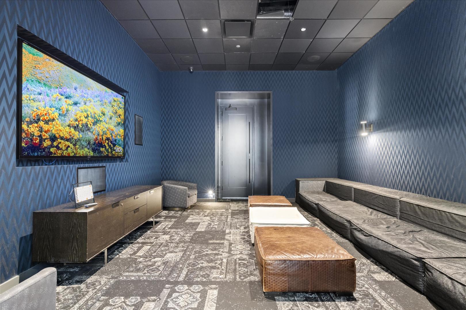 111 West Wacker Drive, Unit PH01 Chicago, IL 60601 - Photo 27 of 37 a living room with furniture and a flat screen tv