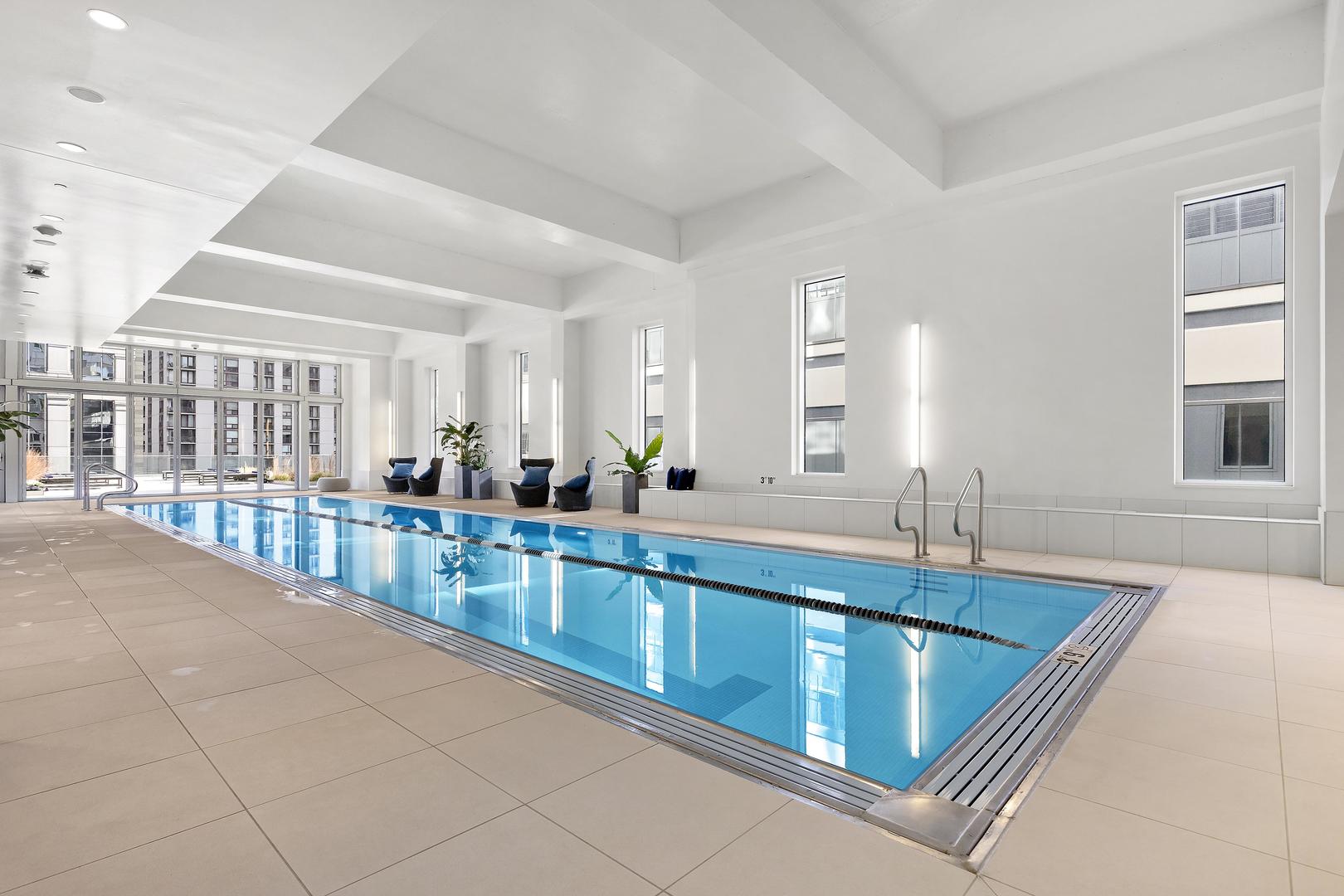 111 West Wacker Drive, Unit PH01 Chicago, IL 60601 - Photo 36 of 37 a large white kitchen with a large window