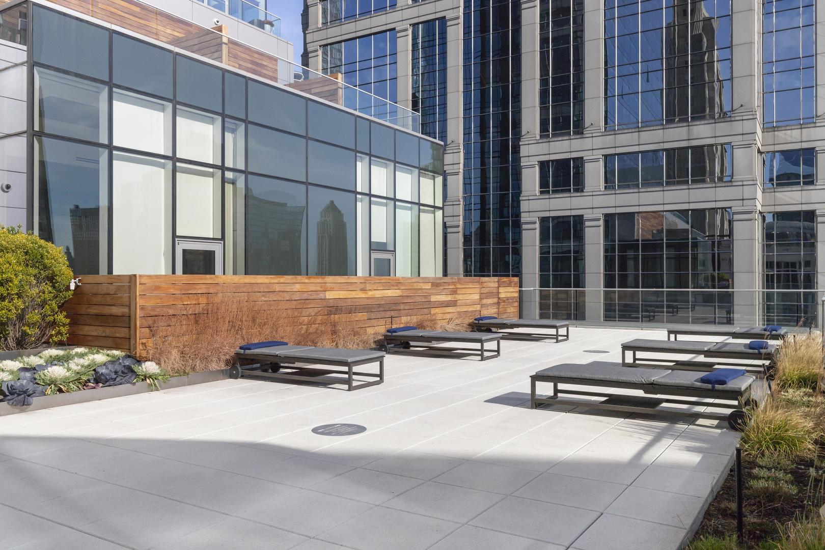 111 West Wacker Drive, Unit PH01 Chicago, IL 60601 - Photo 37 of 37 a couple of cars parked in front of a building