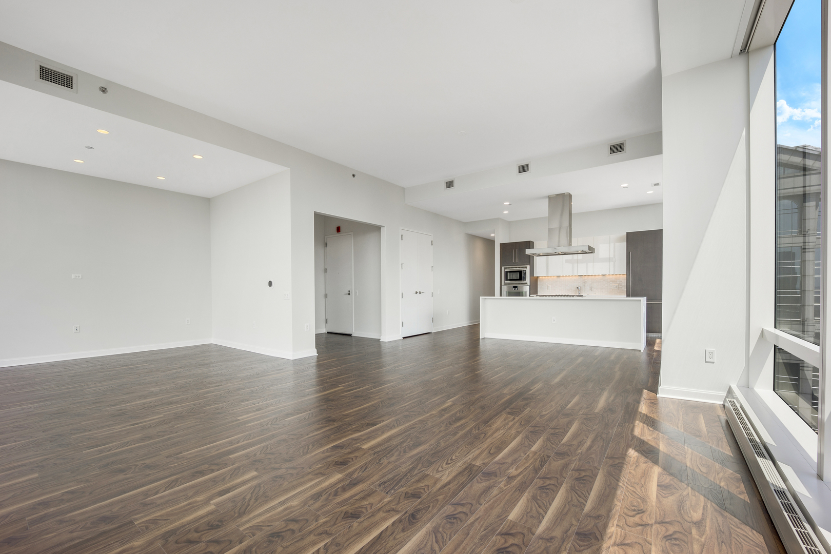 111 West Wacker Drive, Unit PH01 Chicago, IL 60601 - Photo 8 of 37 a view of kitchen with wooden floor