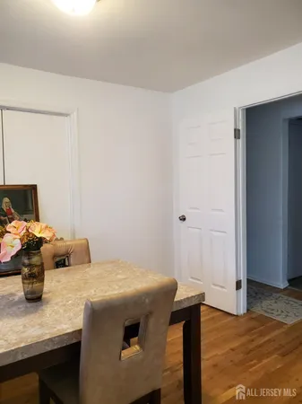 a bedroom with a table and a chair