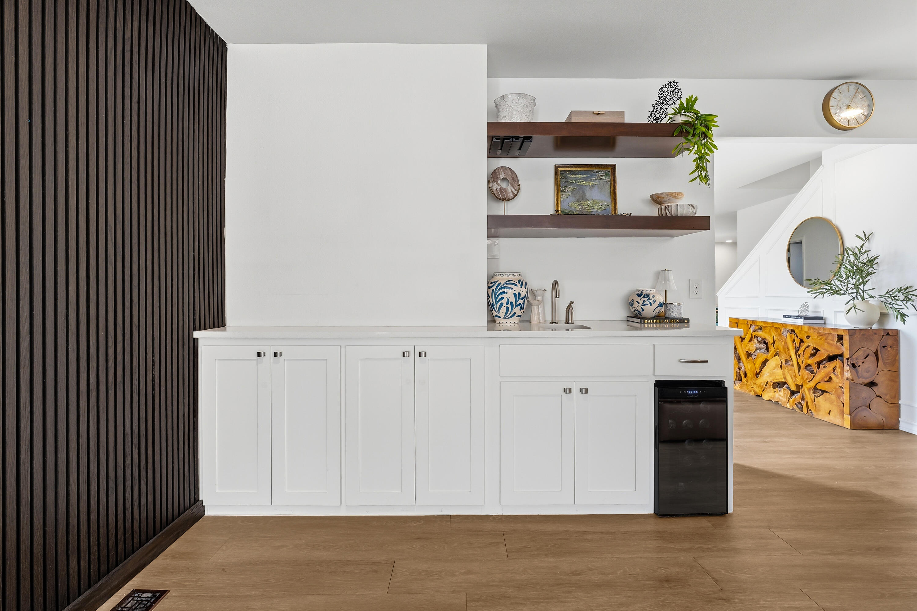 4628 94th Street Lubbock, TX 79424 - Photo 11 of 41 a view of kitchen and utility room with wooden floor
