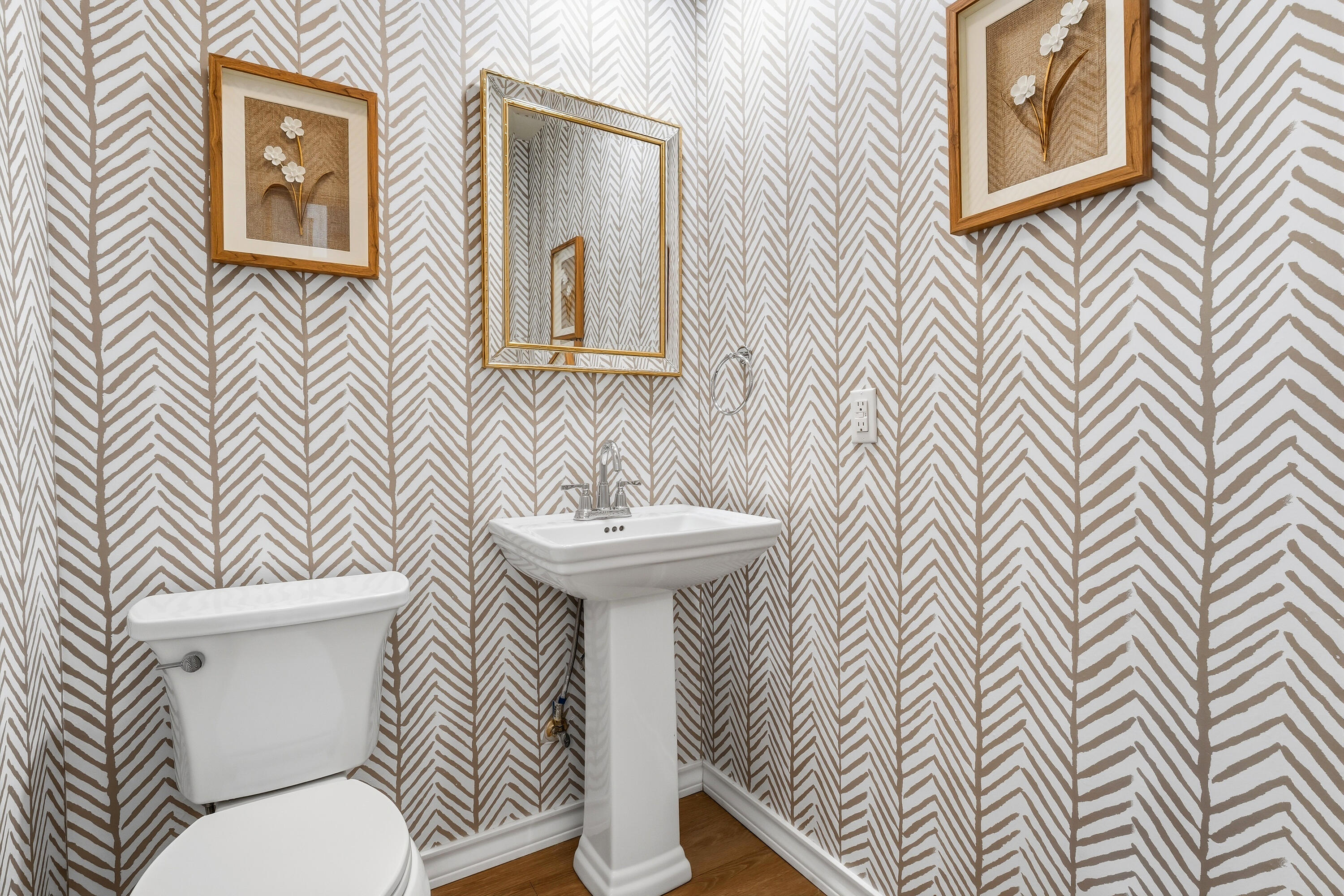 4628 94th Street Lubbock, TX 79424 - Photo 12 of 41 a white toilet sitting next to a bathroom sink