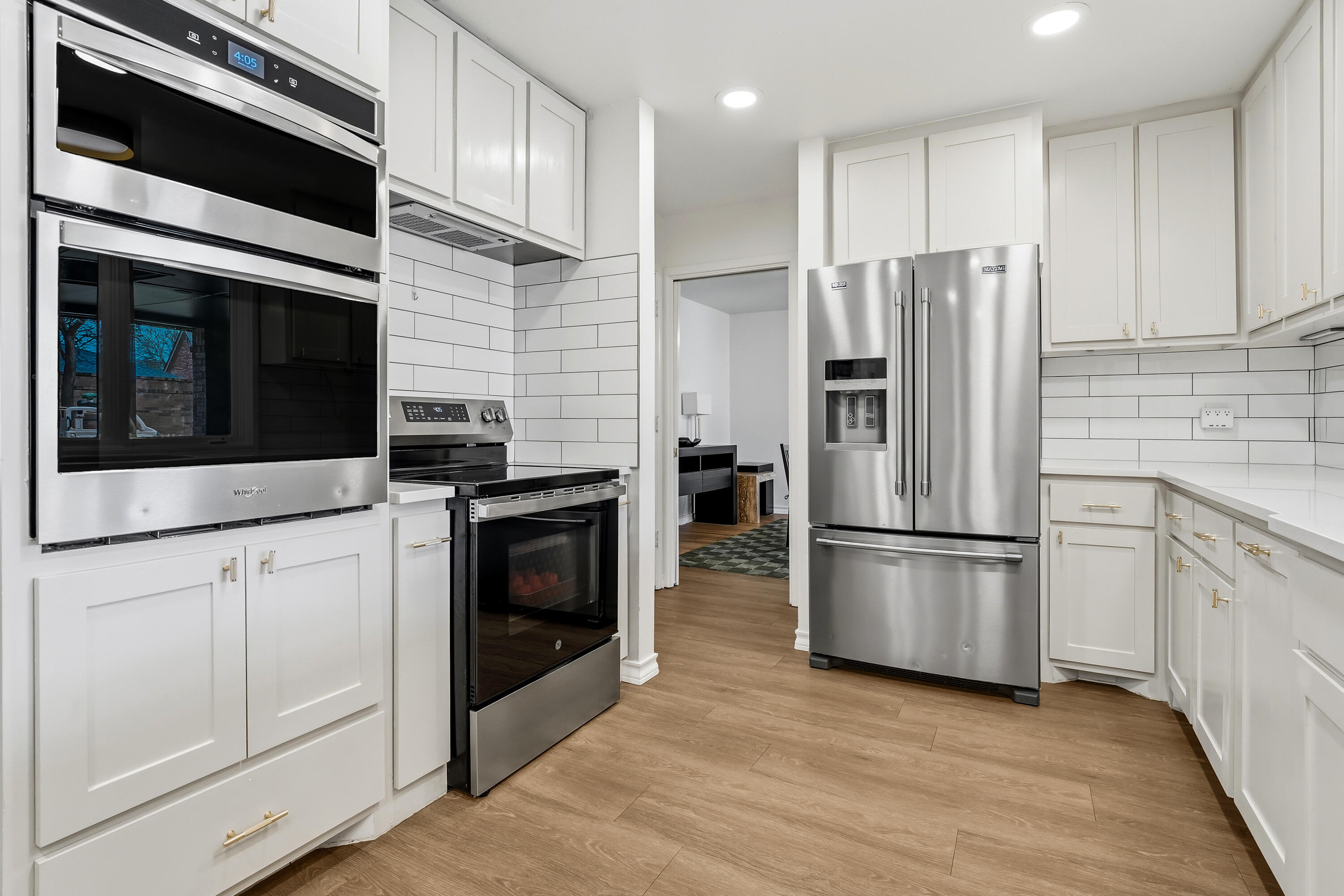 4628 94th Street Lubbock, TX 79424 - Photo 13 of 41 a kitchen with stainless steel appliances and wooden cabinets