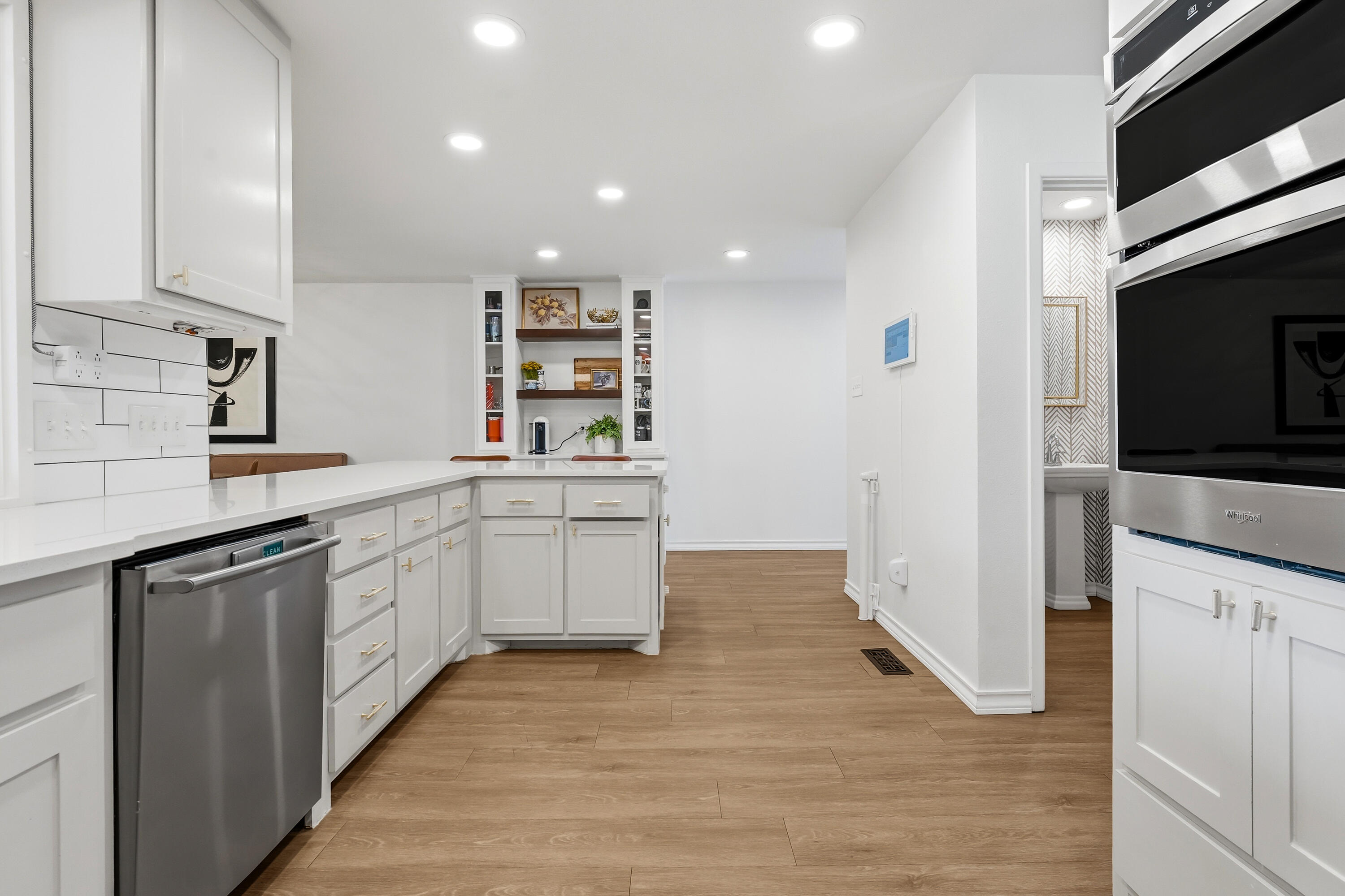 4628 94th Street Lubbock, TX 79424 - Photo 15 of 41 a kitchen with white cabinets appliances and sink